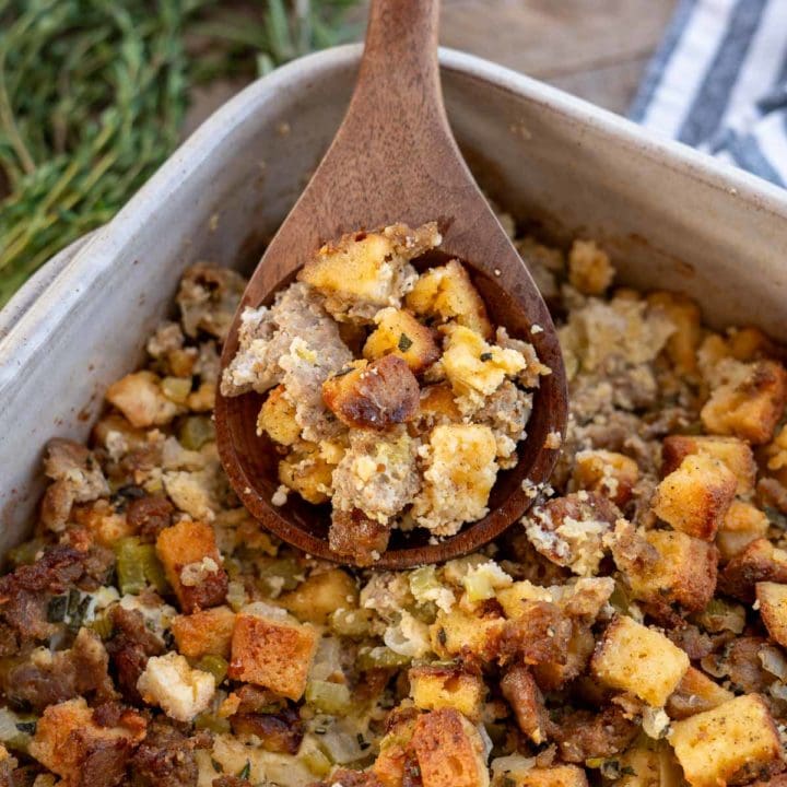 a shot of sausage stuffing with a spoon