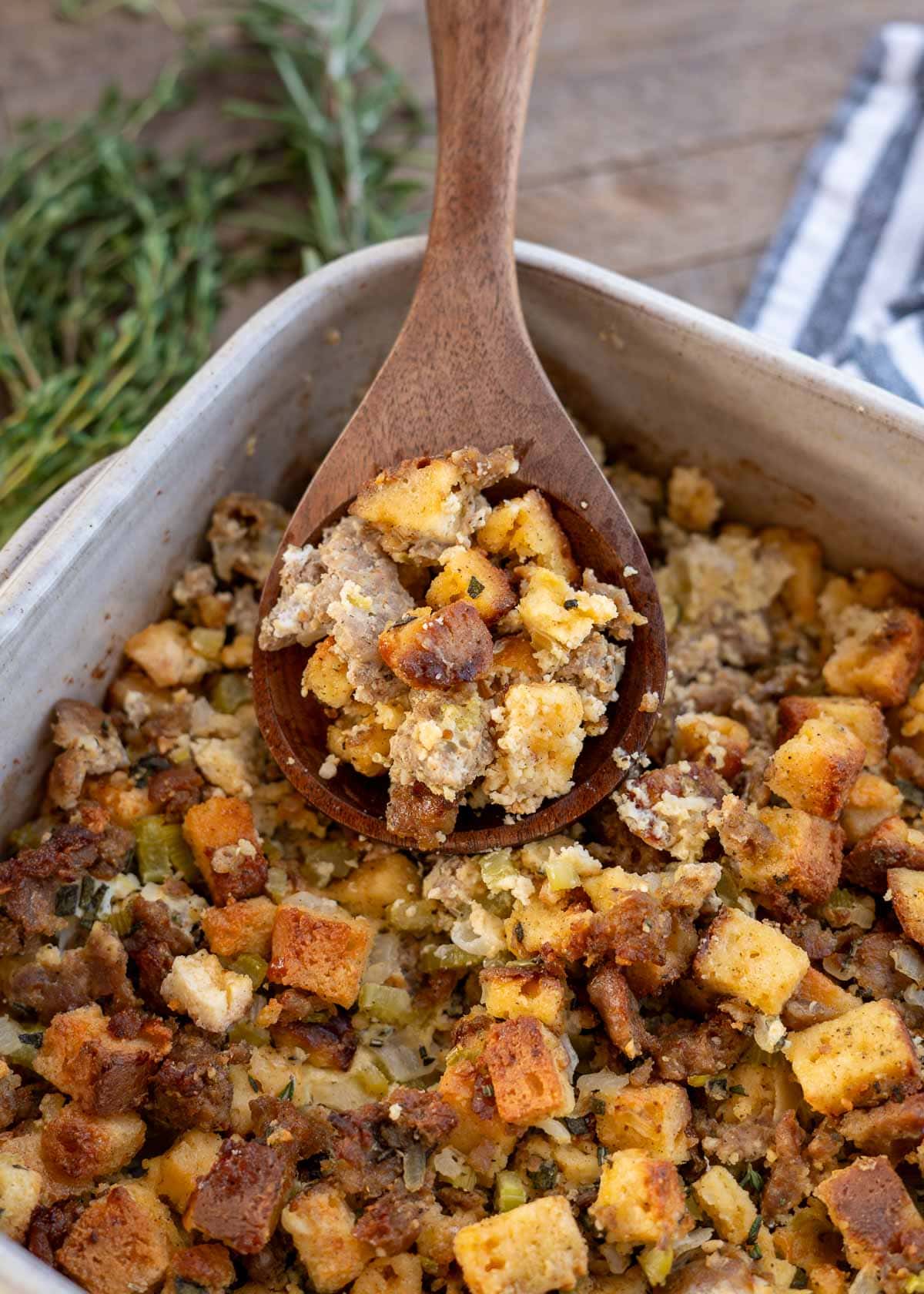 a shot of sausage stuffing with a spoon