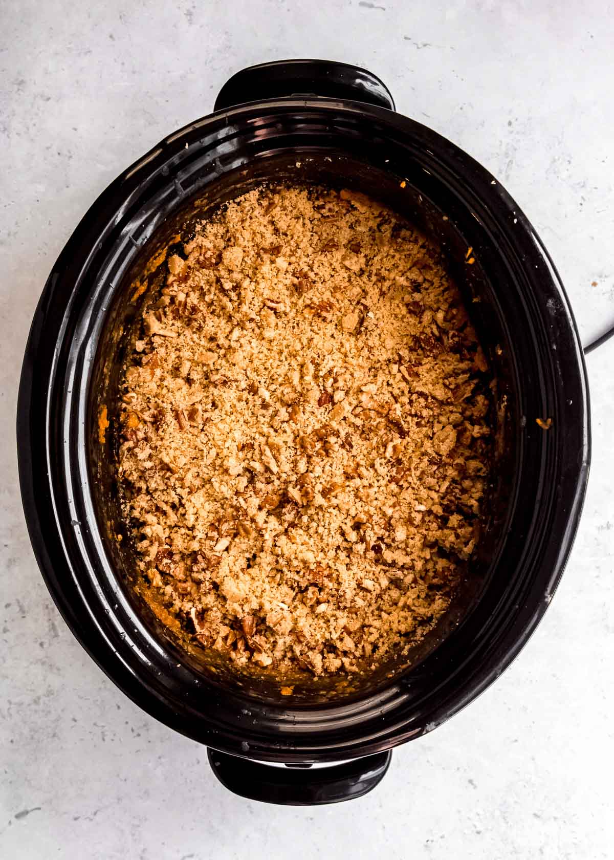 sweet potato casserole in slow cooker with brown sugar toppings
