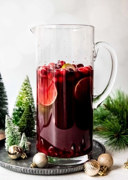 cointreau, simple syrup, cranberries, and limes added to the juices for holiday punch