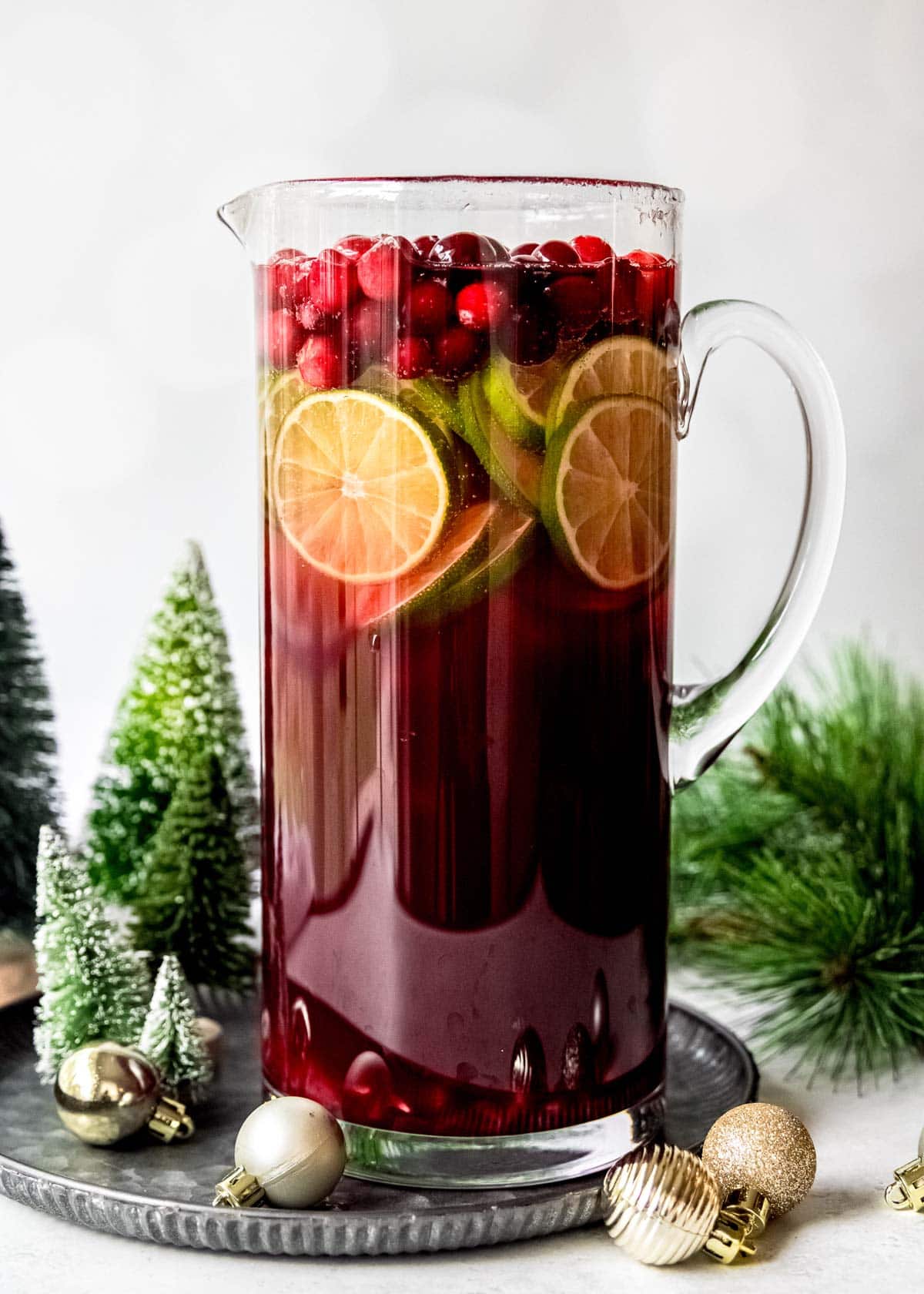 full glass pitcher with cranberry champagne punch for the best christmas punch this holiday season