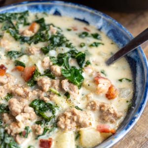 a closeup of a bowl full of zuppa toscana soup