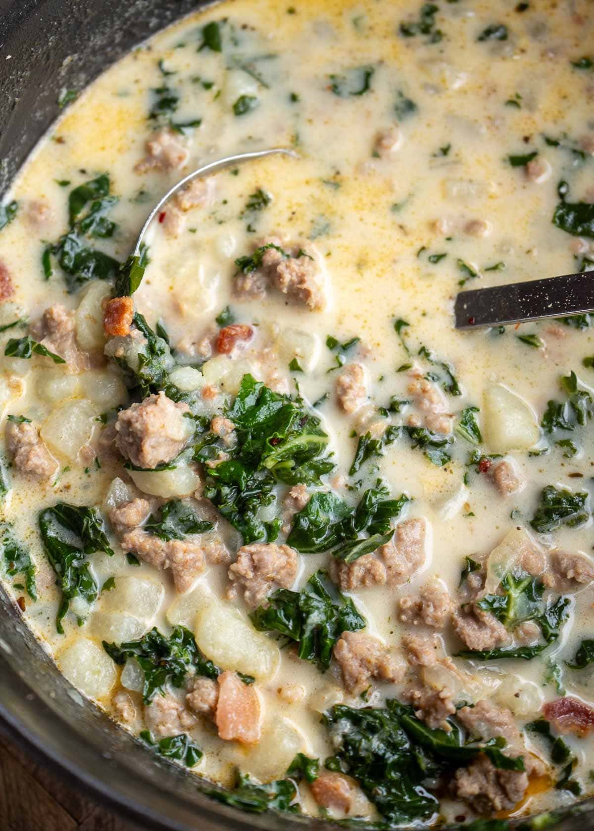 creamy zuppa toscana with turnips, kale, sausage, bacon, and onion