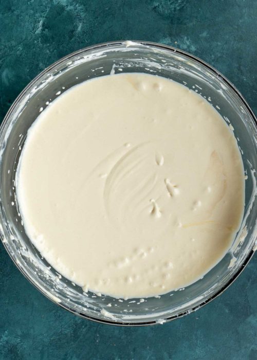 a smooth cheesecake filling in a bowl