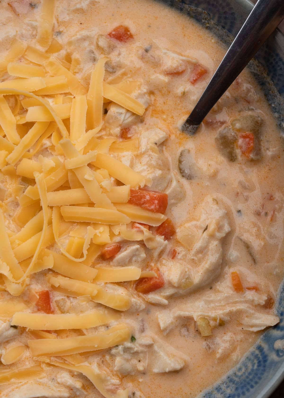 a close up shot of creamy buffalo chicken soup