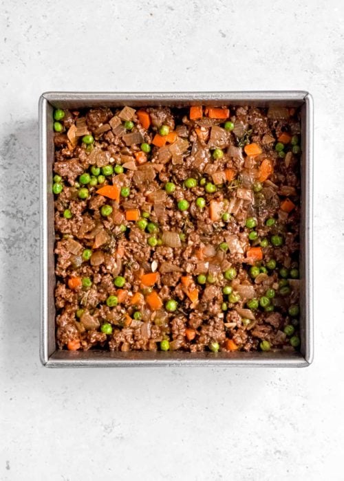 meat mixture in silver baking dish