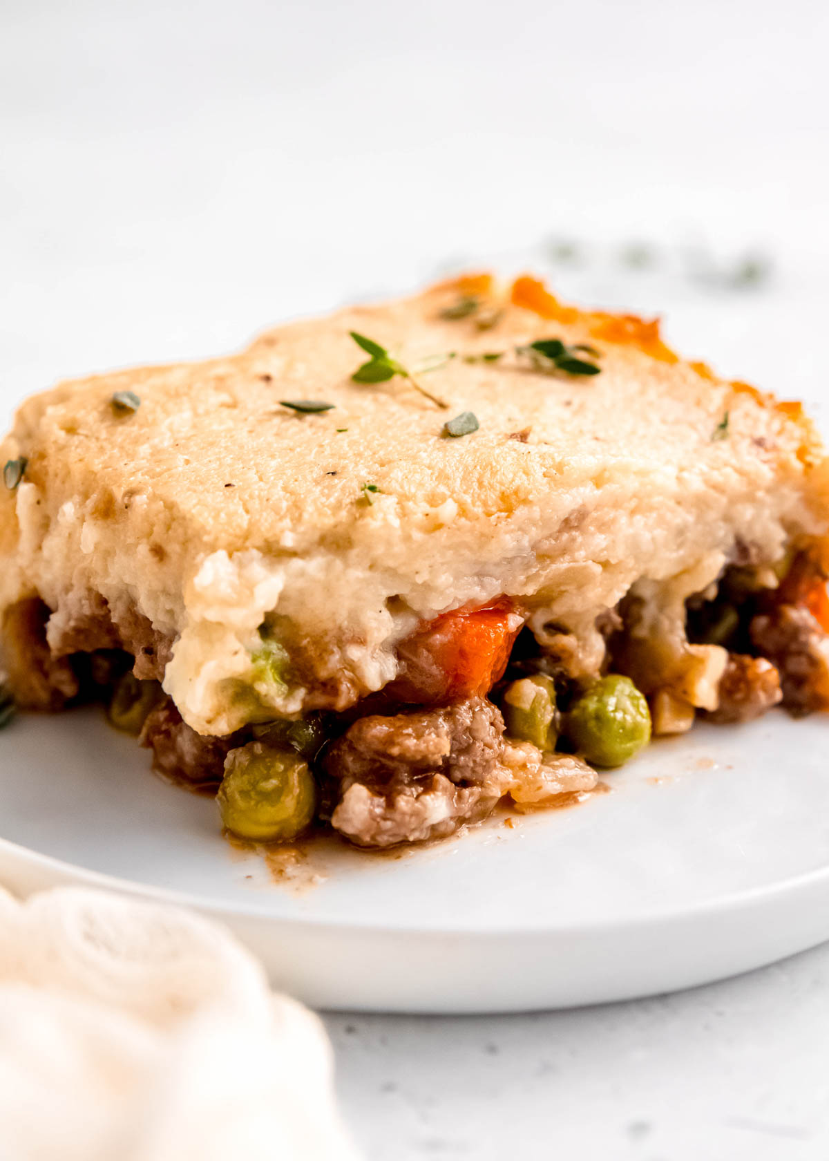 close up of shepherd's pie on white plate