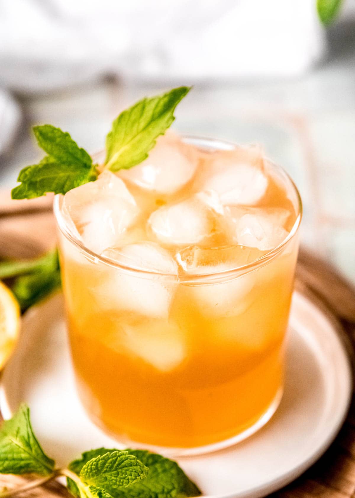 chilled glass with the perfect mint julep with honey simple syrup