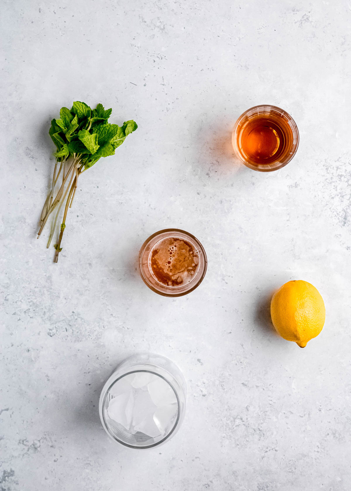 mint julep ingredients on a white background