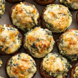 spinach stuffed mushrooms topped with parmesan cheese