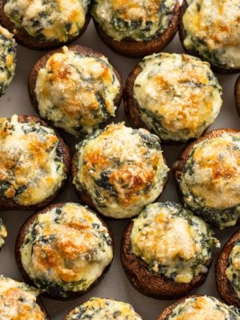 spinach stuffed mushrooms topped with parmesan cheese