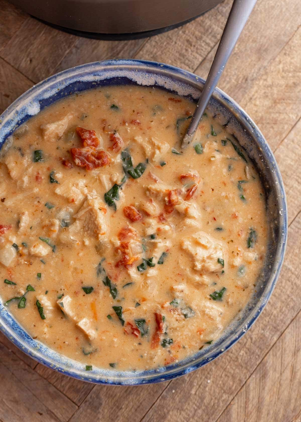 marry me chicken soup in a bowl on a wooden background