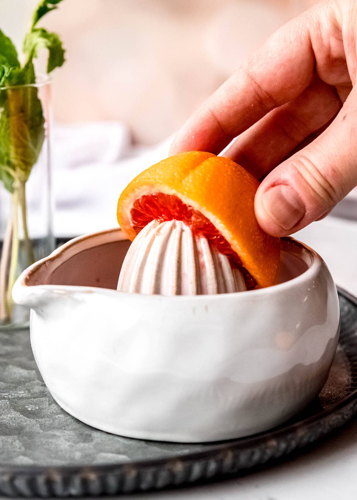 a blood orange being juiced