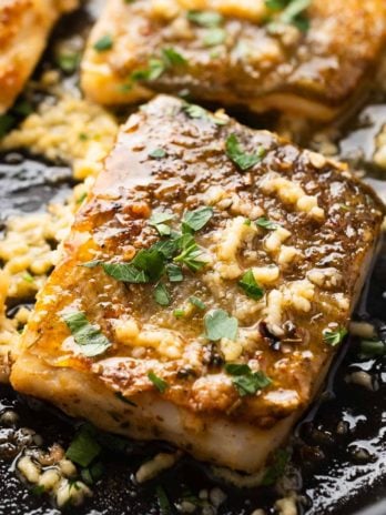 close up of garlic butter cod in skillet