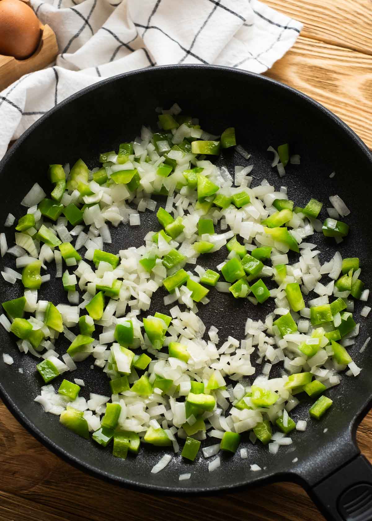 sauteeing onion and peppers in cast iron skillet