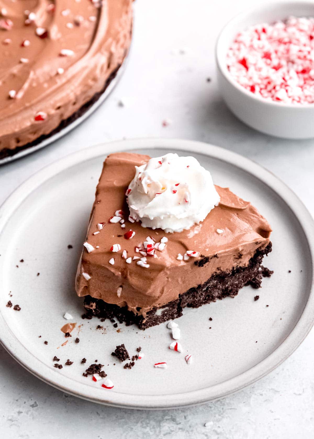 a half-eaten slice of mocha pie with peppermint extract and oreo cookie crust