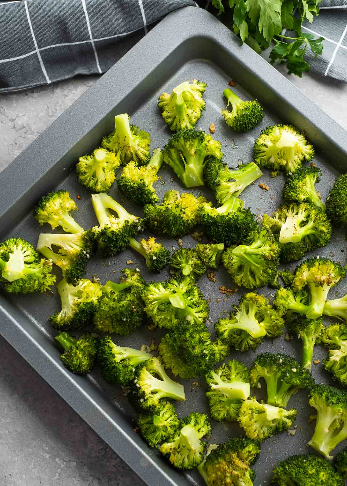 broccoli on a gray sheet pan