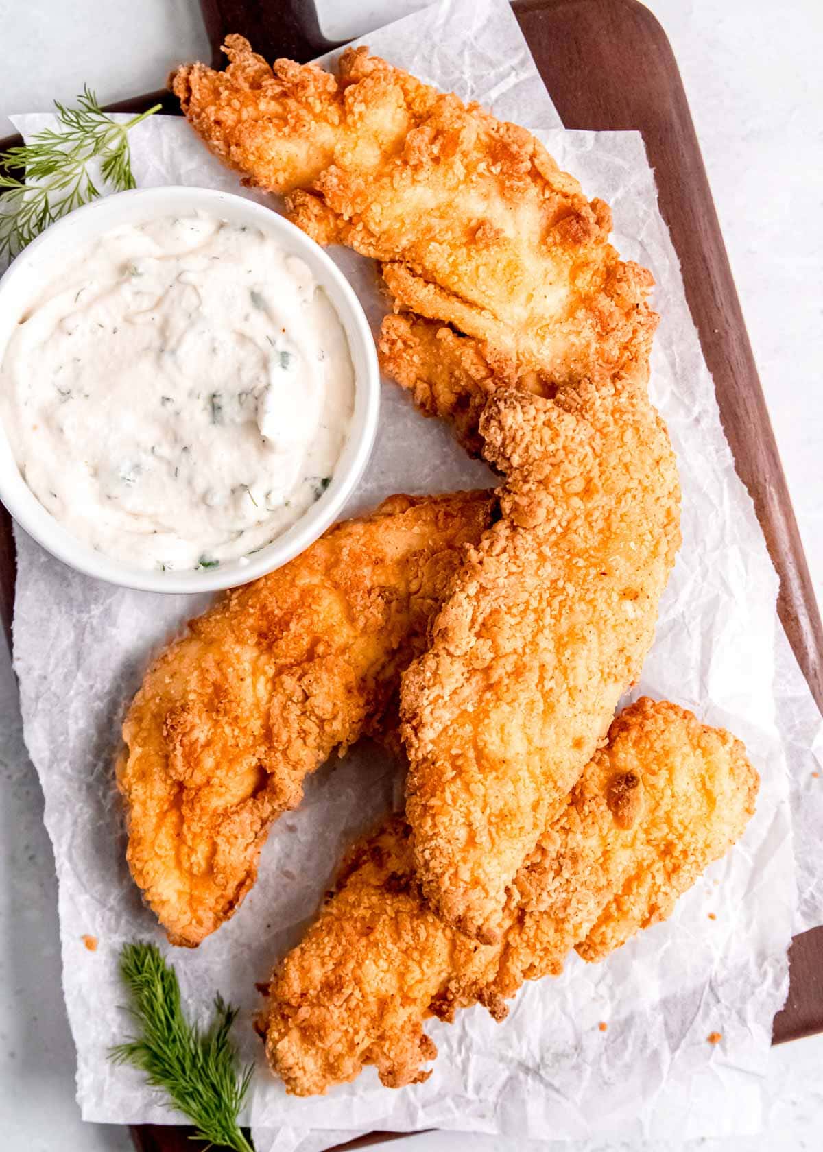 easy buttermilk chicken tenders on paper towels with homemade ranch