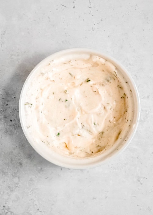 creamy buttermilk ranch dressing mixed together in a bowl