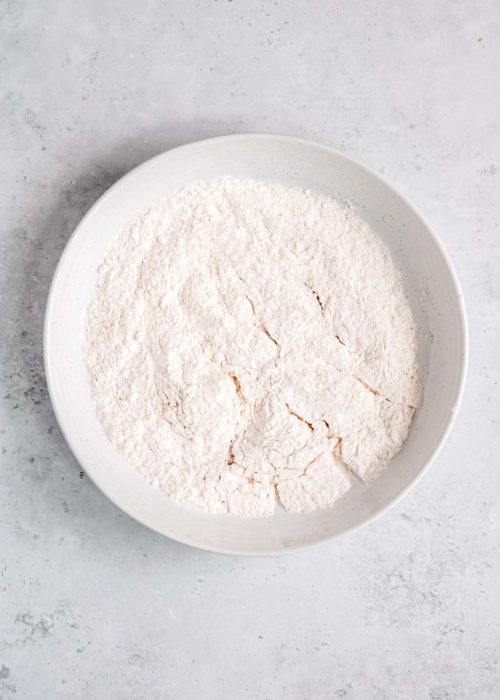 flour and seasonings mixed together in a shallow bowl