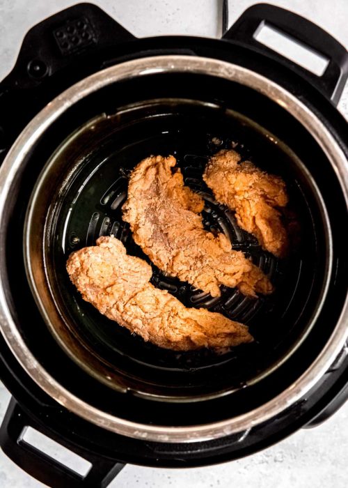 breaded buttermilk chicken tenders in the air fryer basket