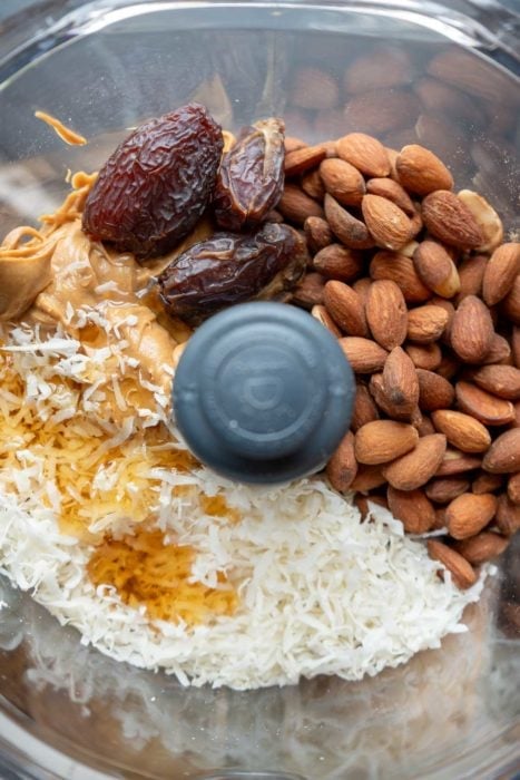 almonds, dates, almond butter, coconut, and maple syrup in a food processor