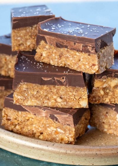 easy almond bars with chocolate stacked on a plate