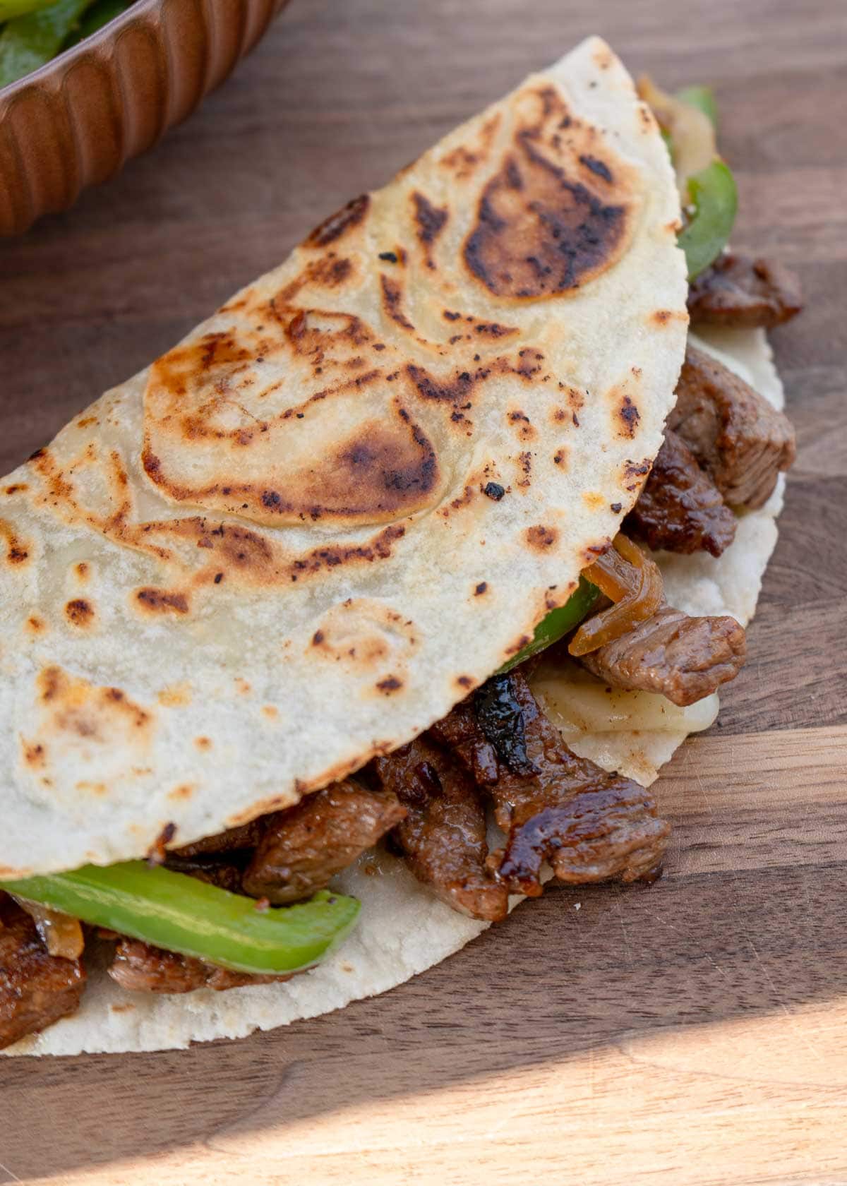 easy philly cheesesteak quesadilla made with sirloin, peppers, and onions