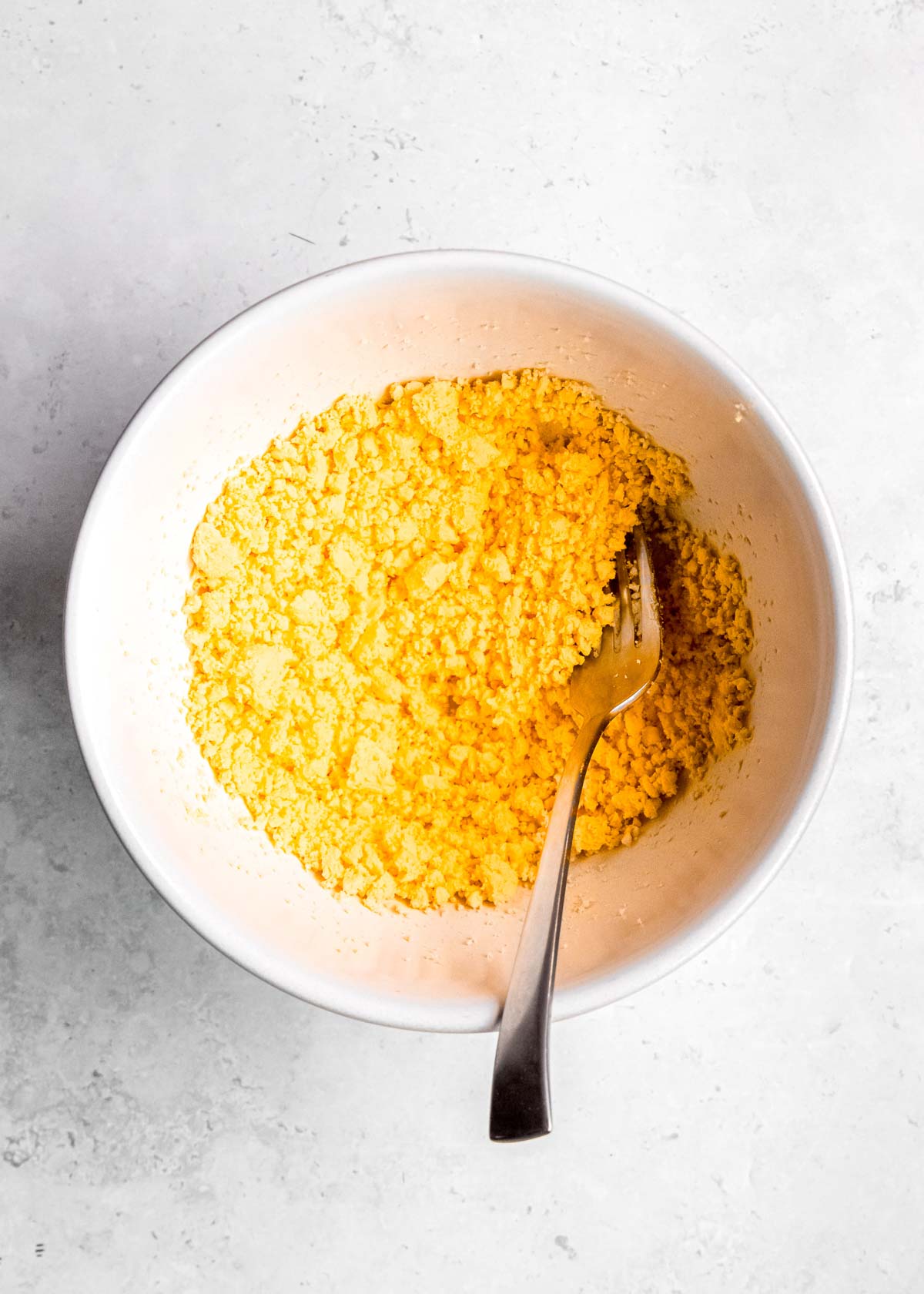 egg yolk in a white bowl