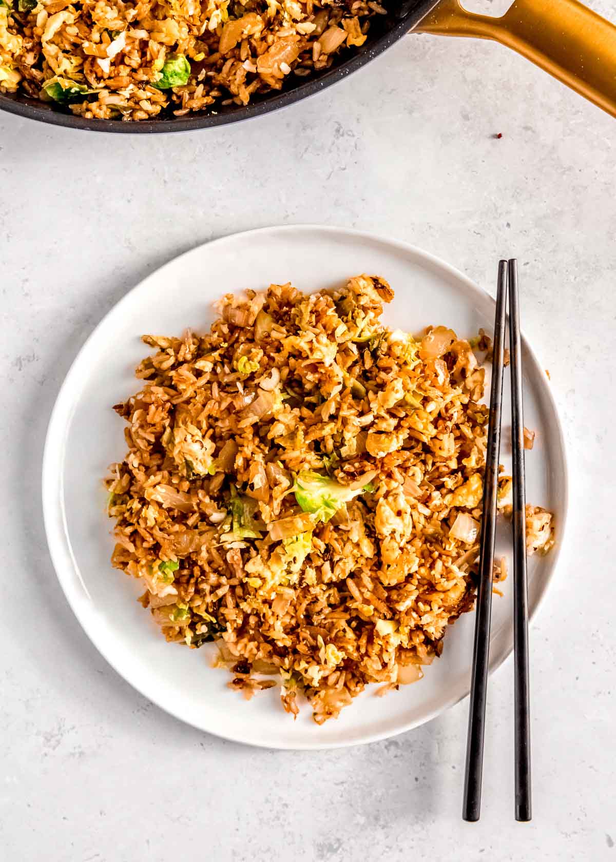 overhead shot of a plate full of fried rice with crispy brussels sprouts