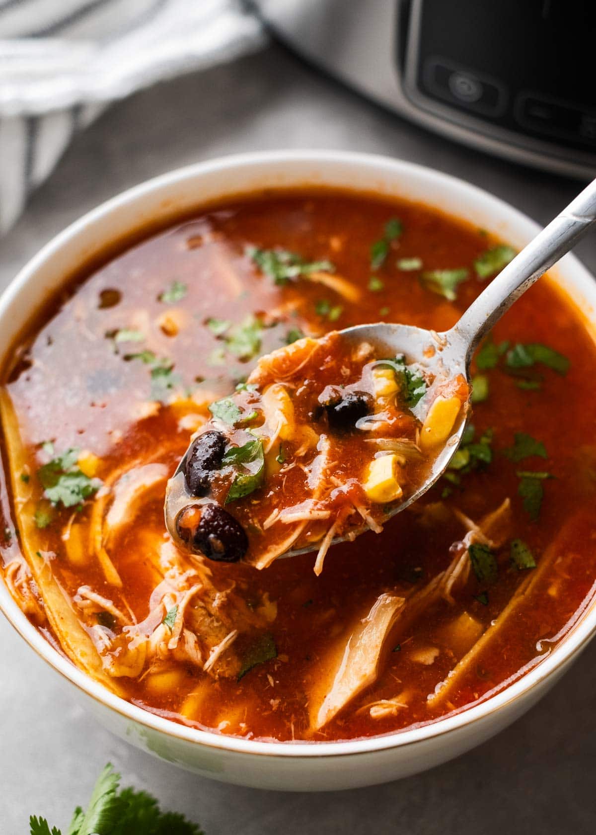 a big spoonful of crockpot enchilada soup