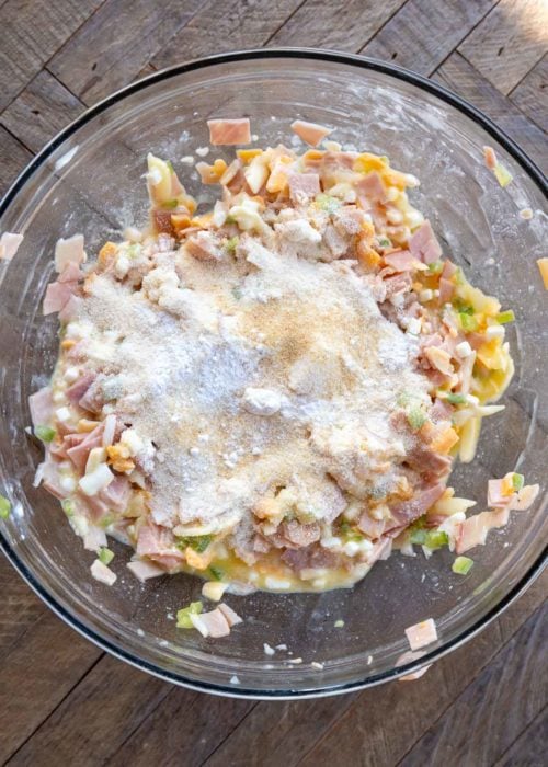 overhead image of denver omelet bite ingredients in a clear mixing bowl