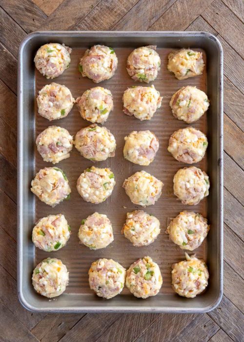 overhead image of raw denver omelet bites on a sheet pan