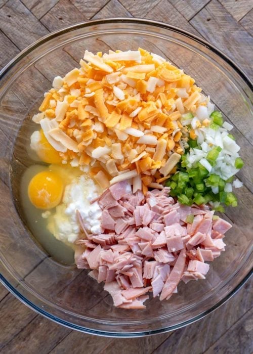 denver omelet bite ingredients in a clear mixing bowl