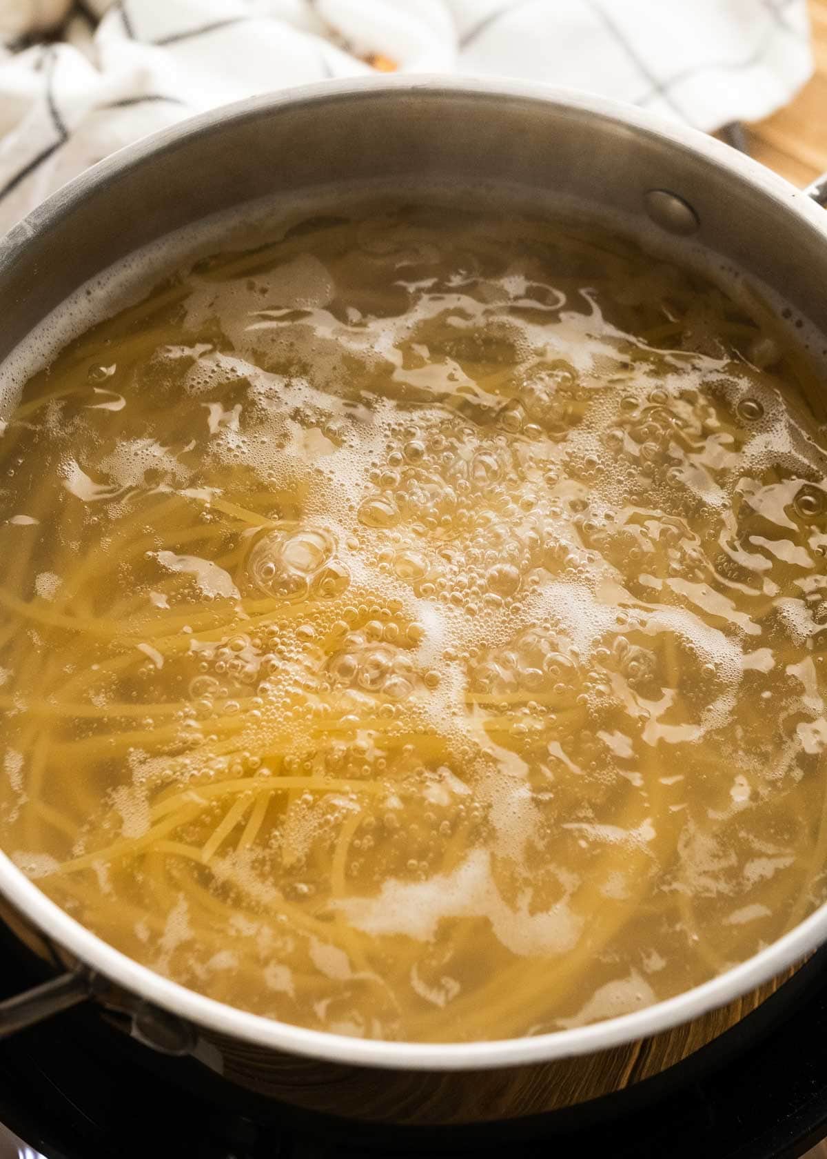 noodles in boiling water for steak lo mein