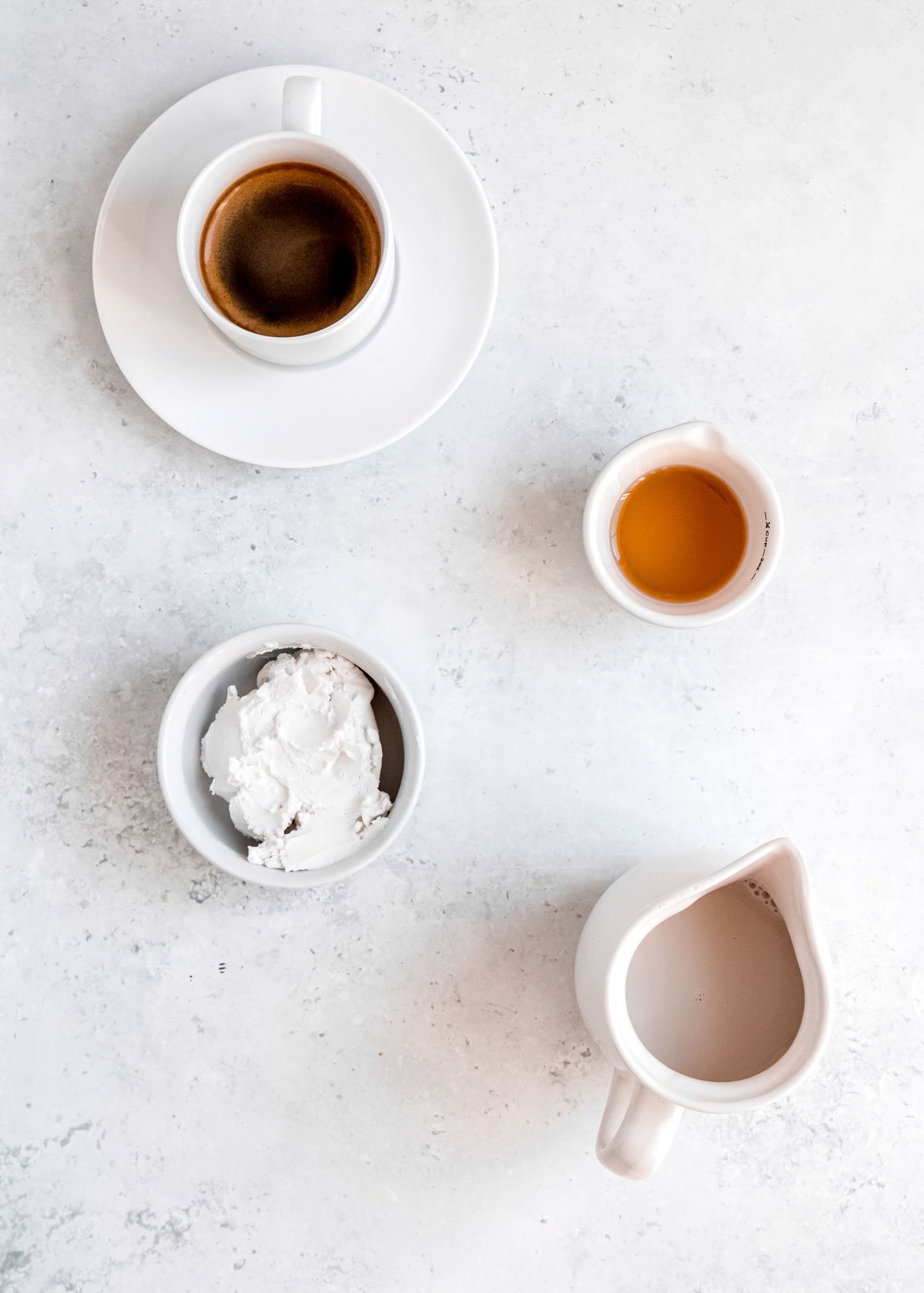 almond milk latte ingredients on a white background