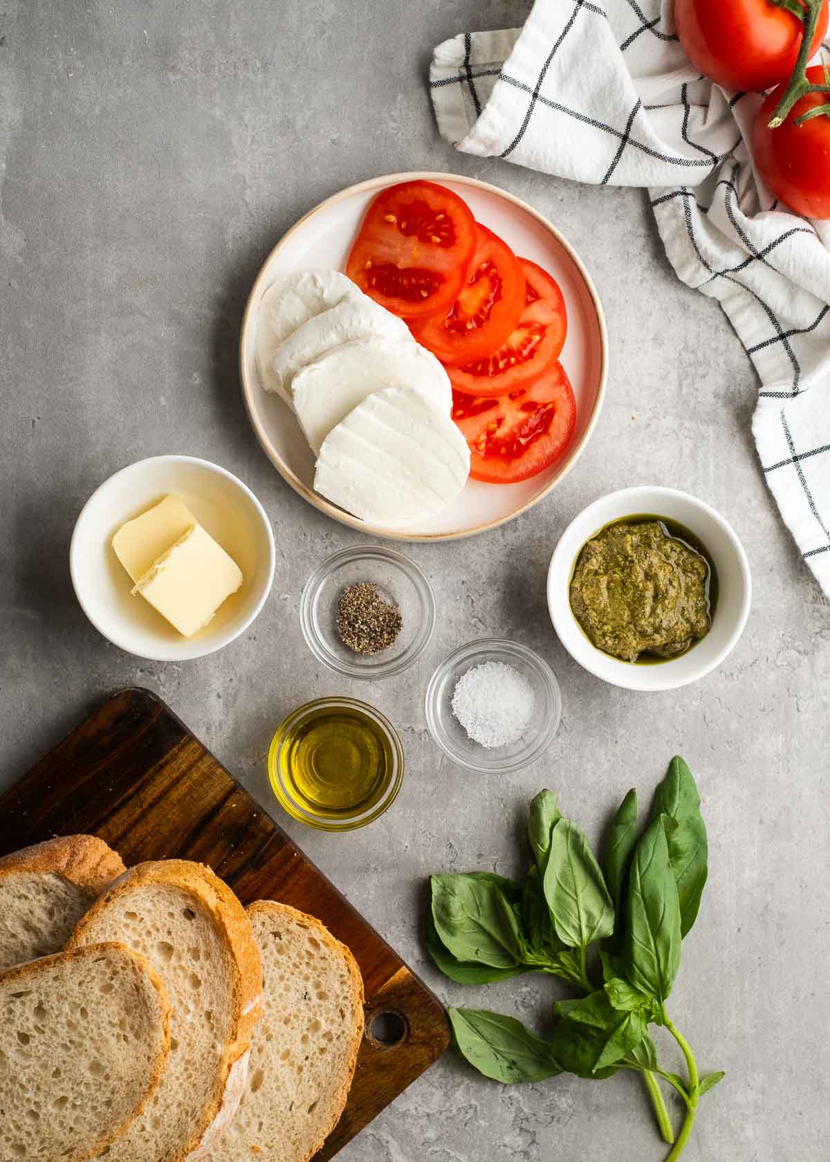 caprese sandwich ingredients on a gray background
