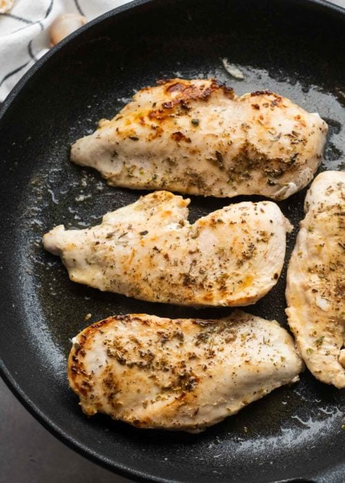 Seared chicken breasts in a cast iron skillet