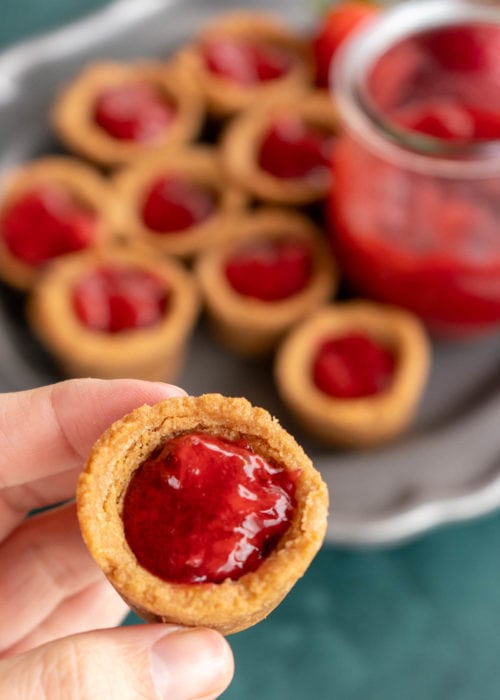 closeup view of one strawberry peanut butter cookie cup