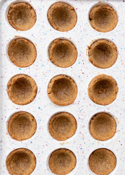delicious cookie cups cooling in a silicone muffin pan