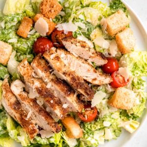 overhead, close up image of grilled chicken caesar salad