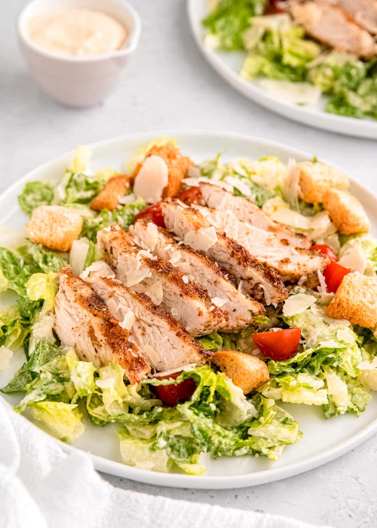 a shot of fresh chicken salad on a white plate