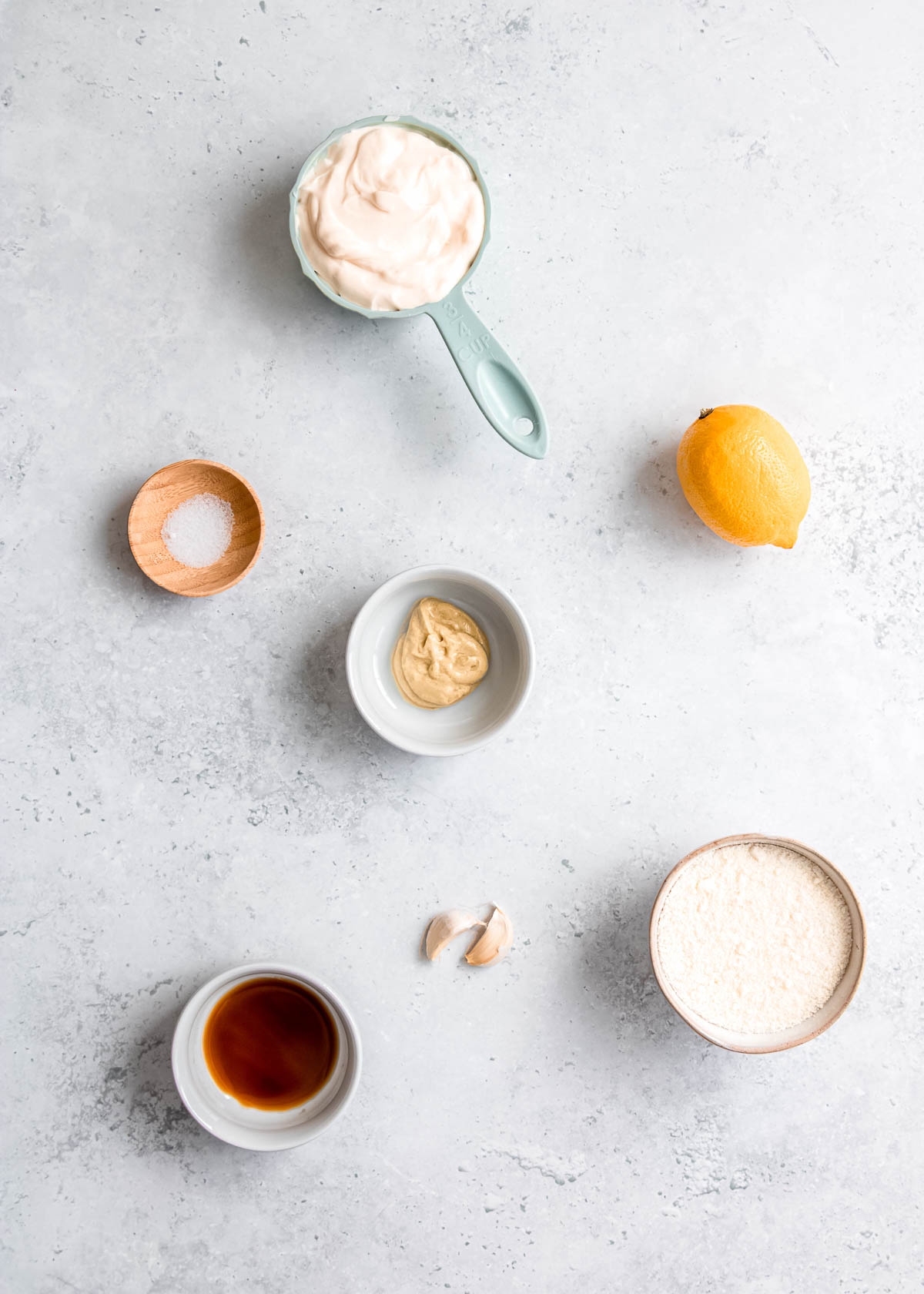 caesar dressing ingredients on a white background