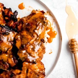 overhead image of honey mustard chicken on white plate