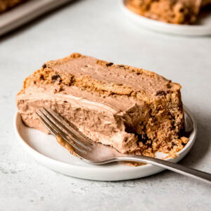 a slice of mocha icebox cake on a plate with a fork