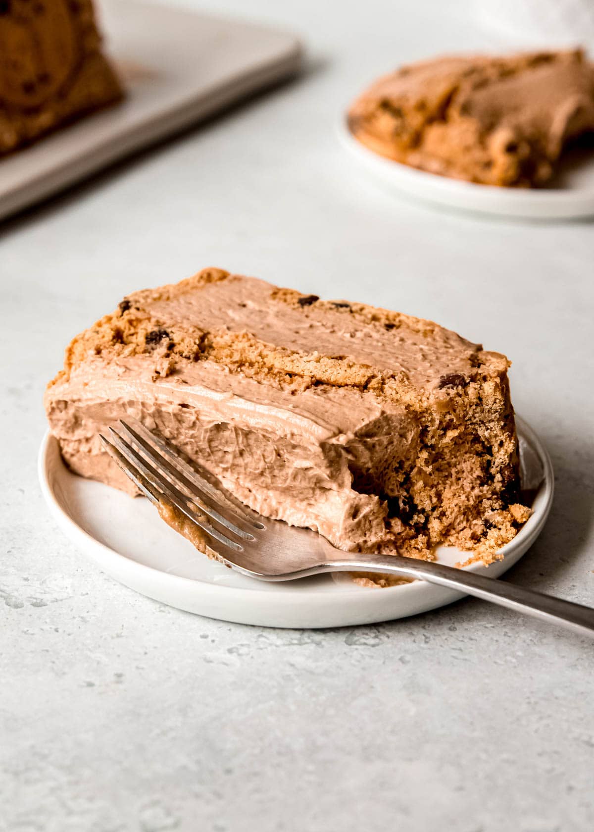 a slice of mocha icebox cake on a plate with a fork