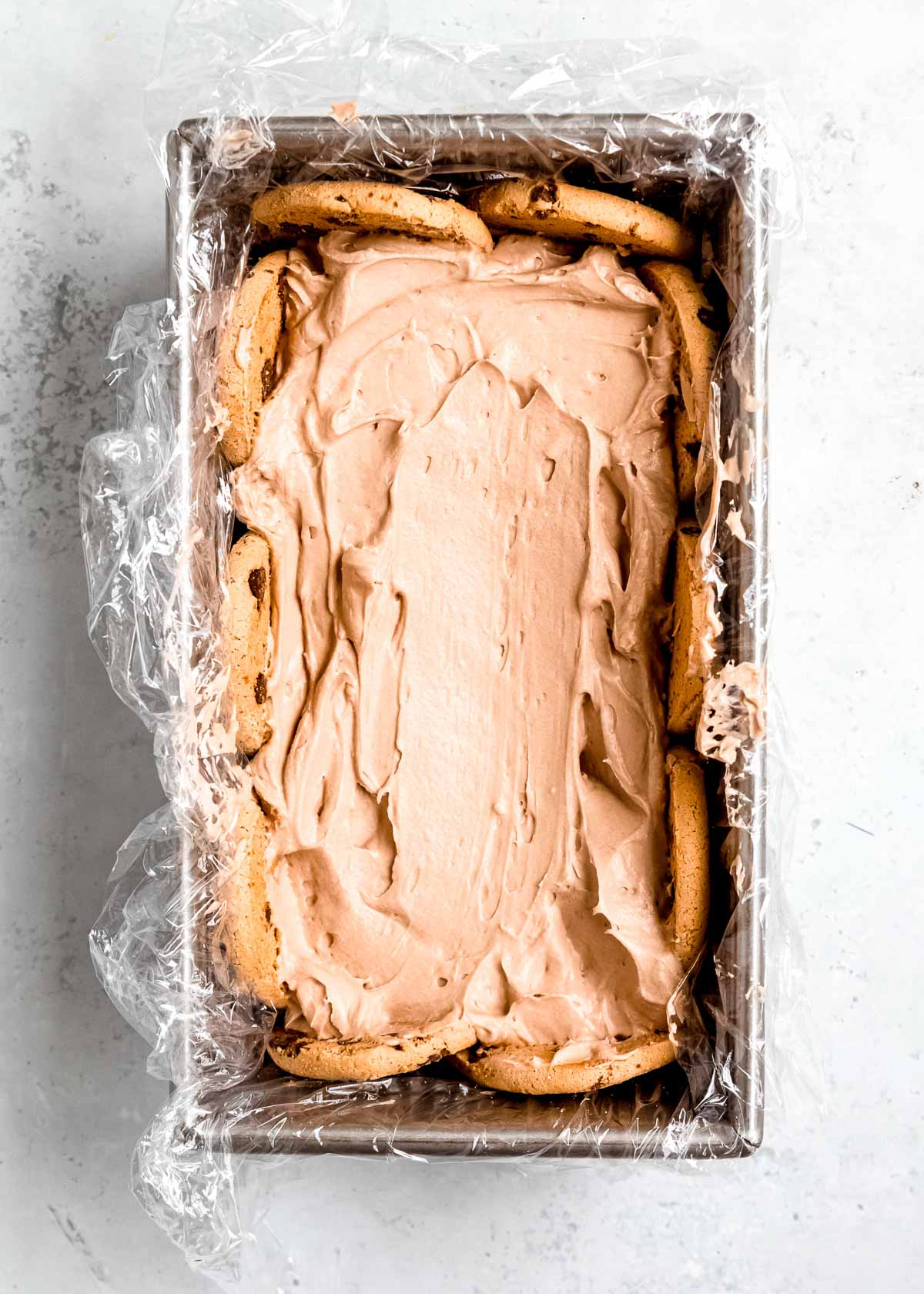 creamy mocha filling in a loaf pan with chocolate chip cookies