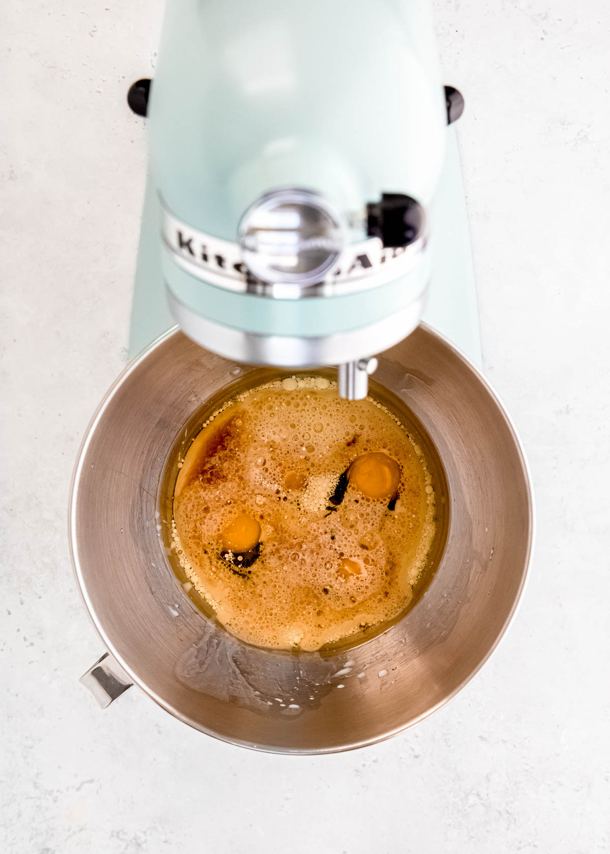 wet cupcake ingredients (like eggs, molasses, whole milk, and vanilla extract) in a stand mixer