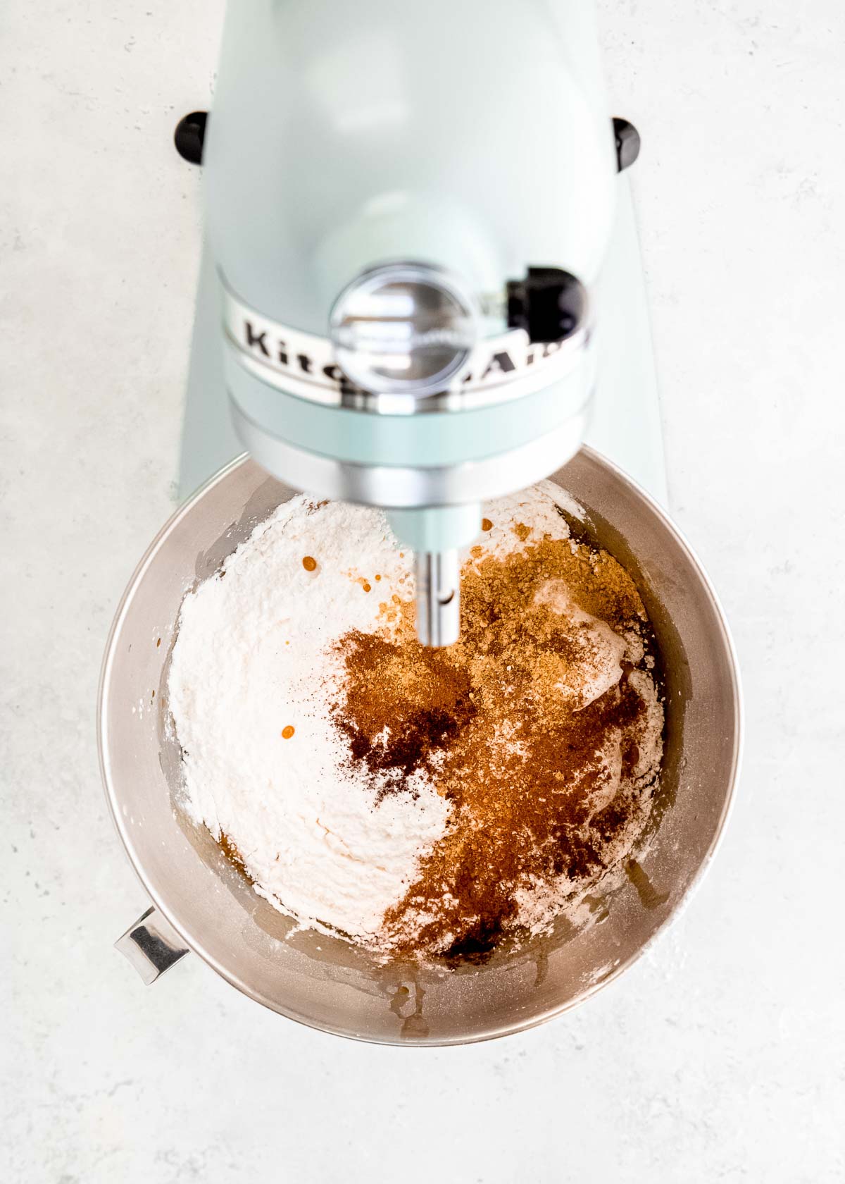 dry cupcake ingredients (King Arthur GF cake mix, cinnamon, cloves, nutmeg, and ginger) in a stand mixer with the wet ingredients