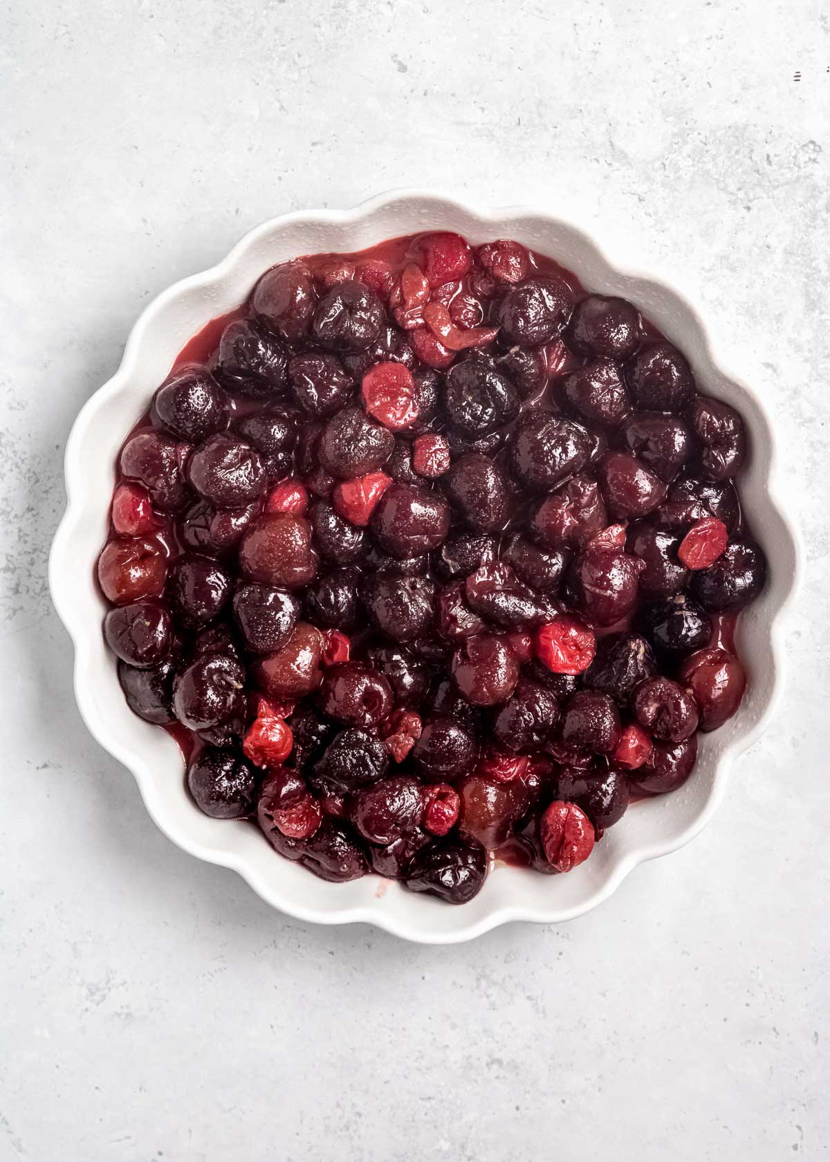 sweetened cherry filling in a greased deep-dish pie pan